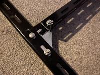 Brackets, nuts and bolts from the hardware kit are used to assemble the jig